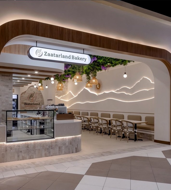 Zaatarland Bakery entrance, curved counter and feature lighting